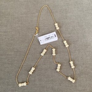 Cream “Take a Bow” Kate Spade necklace.